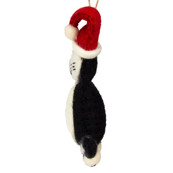 This Global Groove Life, handmade, ethical, fair trade, eco-friendly, sustainable, 100% New Zealand Wool, black and white and red, felt kitty ornament with Santa hat was created by artisans in Kathmandu Nepal and will be a beautiful addition to your Christmas tree this holiday season.