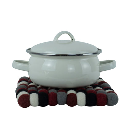 This Global Groove Life, handmade, ethical, fair trade, eco-friendly, sustainable, black, grey, red & white 100% New Zealand wool felt trivet was created by artisans in Kathmandu Nepal and will bring colorful warmth and functionality to your table top.