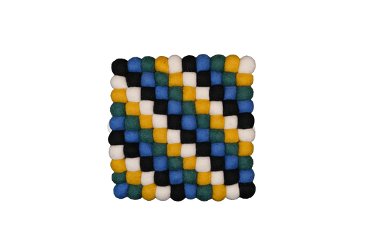 This Global Groove Life, handmade, ethical, fair trade, eco-friendly, sustainable, black, yellow, green & white 100% New Zealand wool felt Moroccan inspired trivet was created by artisans in Kathmandu Nepal and will bring colorful warmth and functionality to your table top.