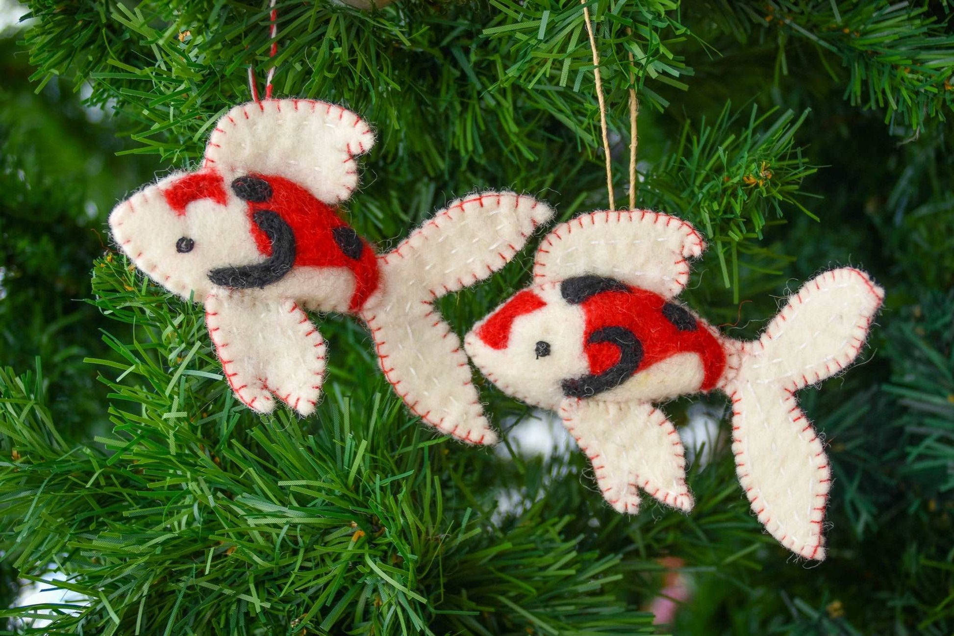 This Global Groove Life, handmade, ethical, fair trade, eco-friendly, sustainable, New Zealand wool felt, red, black & white Koi Fish ornament set of 2, was created by artisans in Kathmandu Nepal and will bring colorful warmth and fun to your Christmas tree this season.